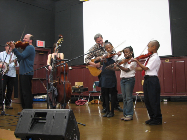 Tony Trischka, Catherine Popper, Danny Weiss, and students at PS221 Crown Heights